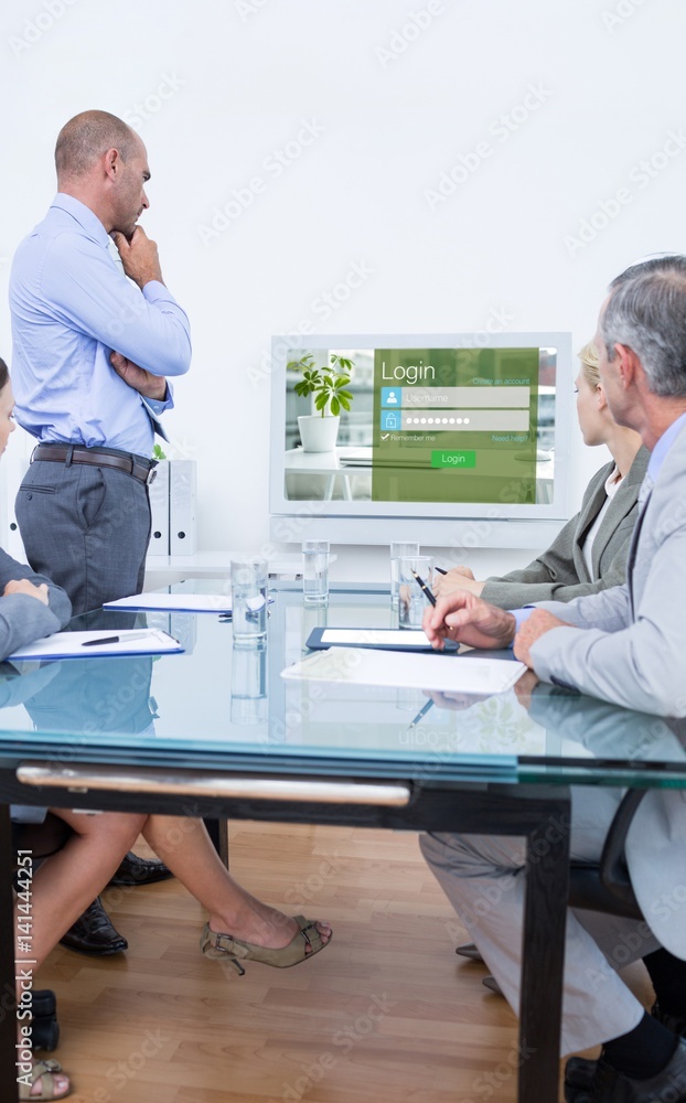 Composite image of business team looking at white screen