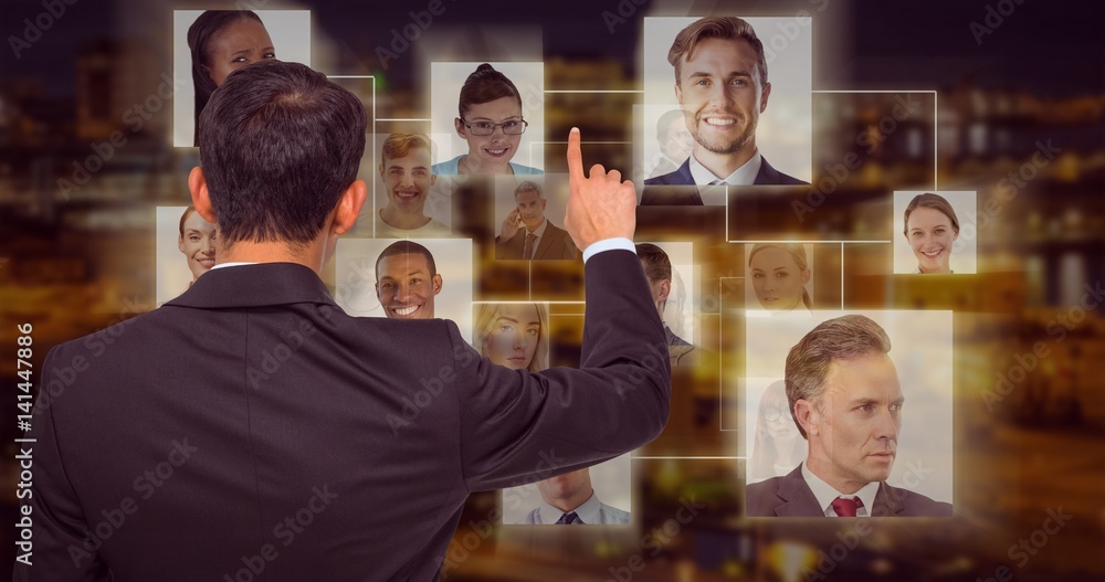 Composite image of asian businessman pointing