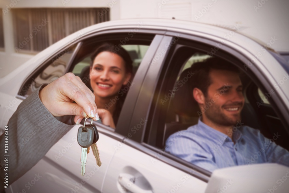 Composite image of person handing keys to someone else