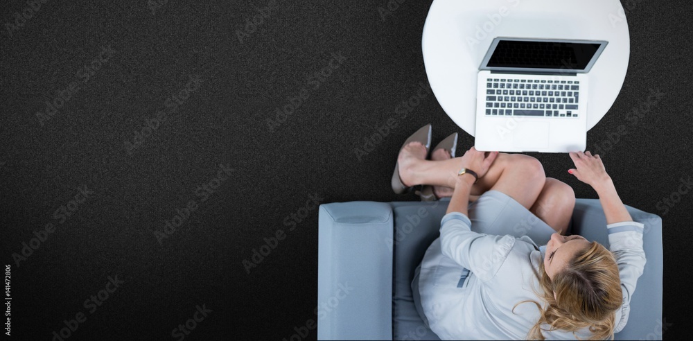 Composite image of woman on her laptop