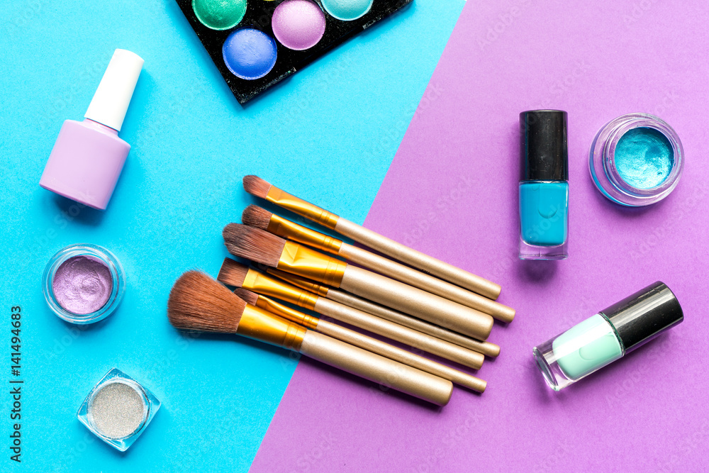 set of decorative cosmetics on colorful background top view