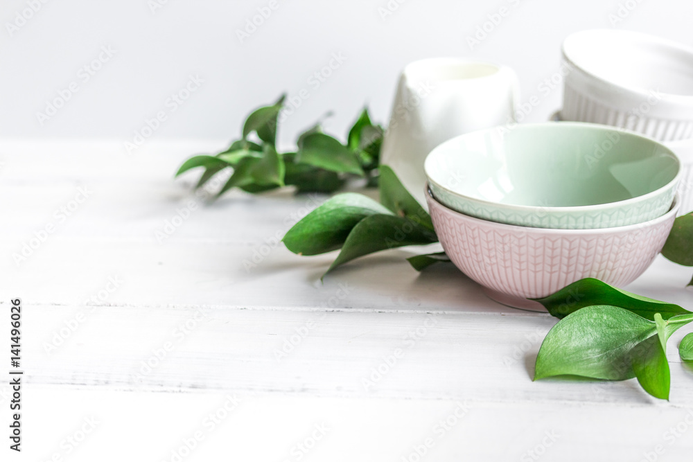 ceramic tableware with flowers on white background