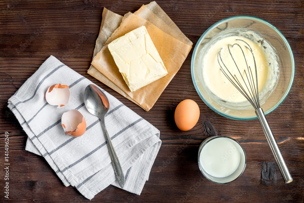 cooking pancake on wooden background top view ingredients for making