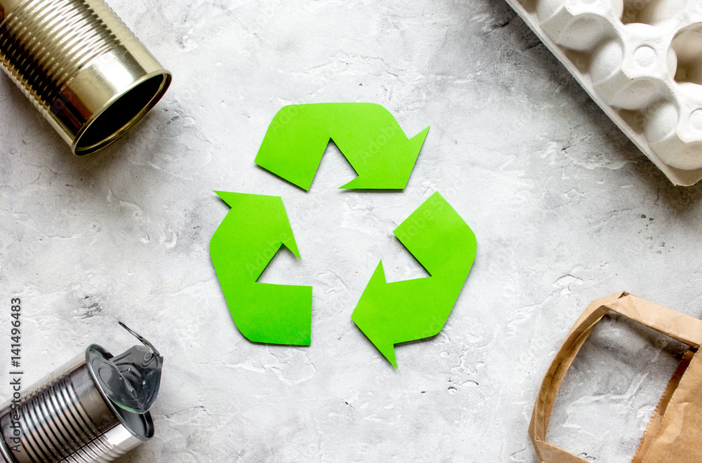 environment concept with recycling symbol on stone background top view mock-up