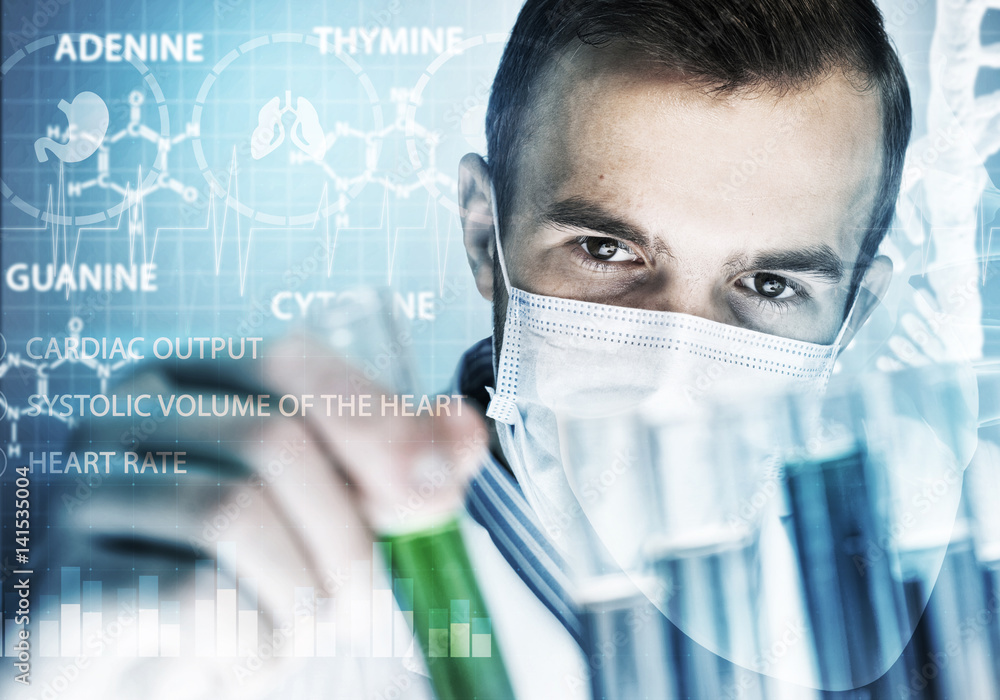 Portrait of concentrated male scientist working with reagents in laboratory