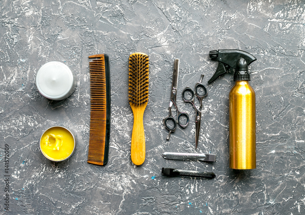 styling hair with tools in barbershop on gray background top view mockup