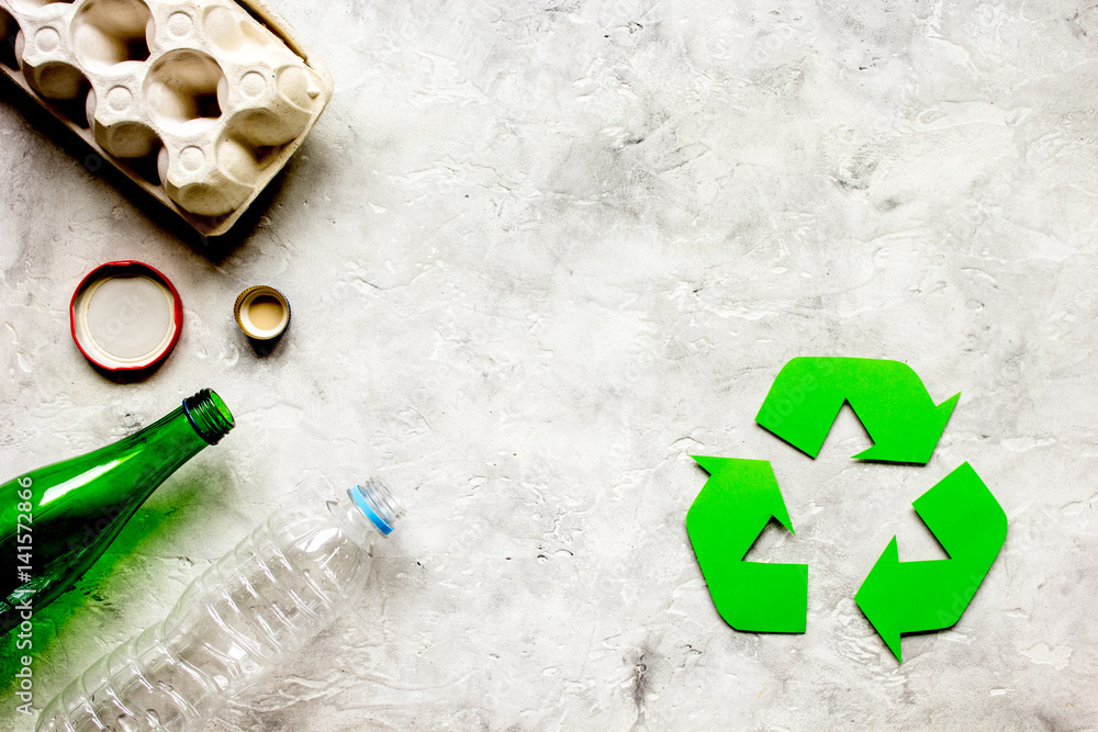 environment concept with recycling symbol on stone background top view mock-up