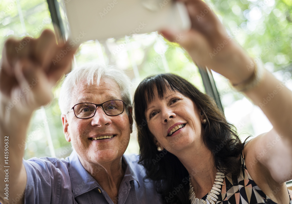 Mature couple taking selfie together