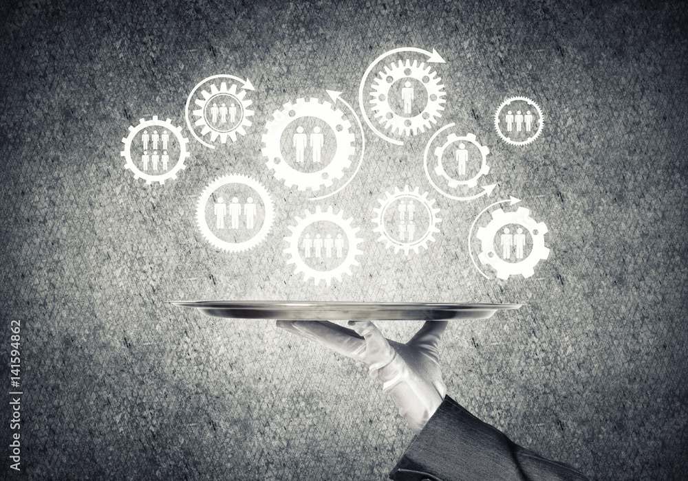 Waiter hand with white gloves holding silver plate full of social media communication icons