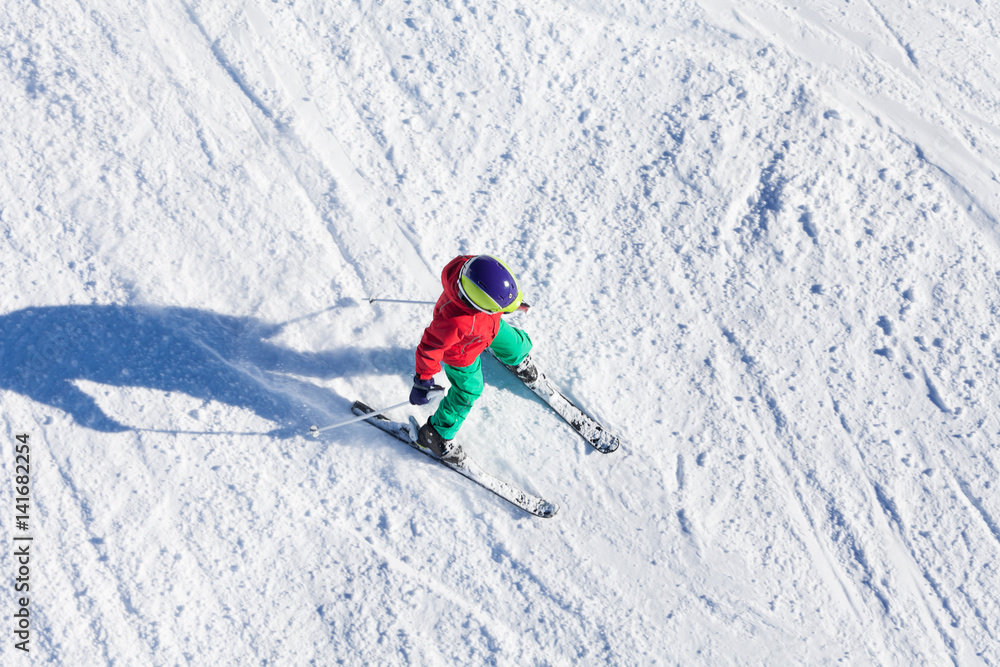 Top view portrait of boy riding fast on downhill