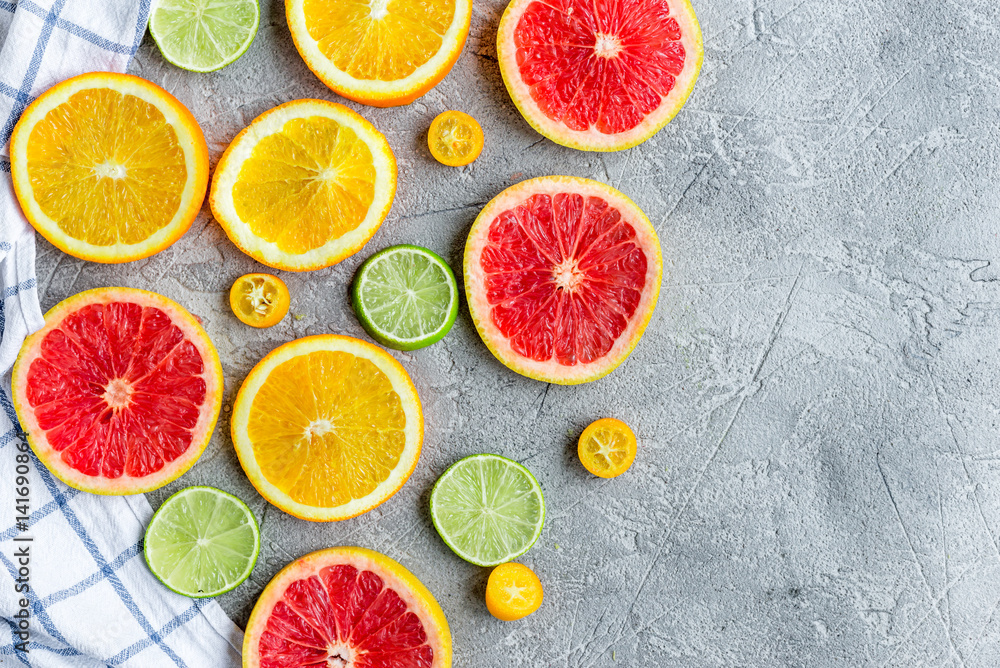 sliced citrus on stone table background top view mock up