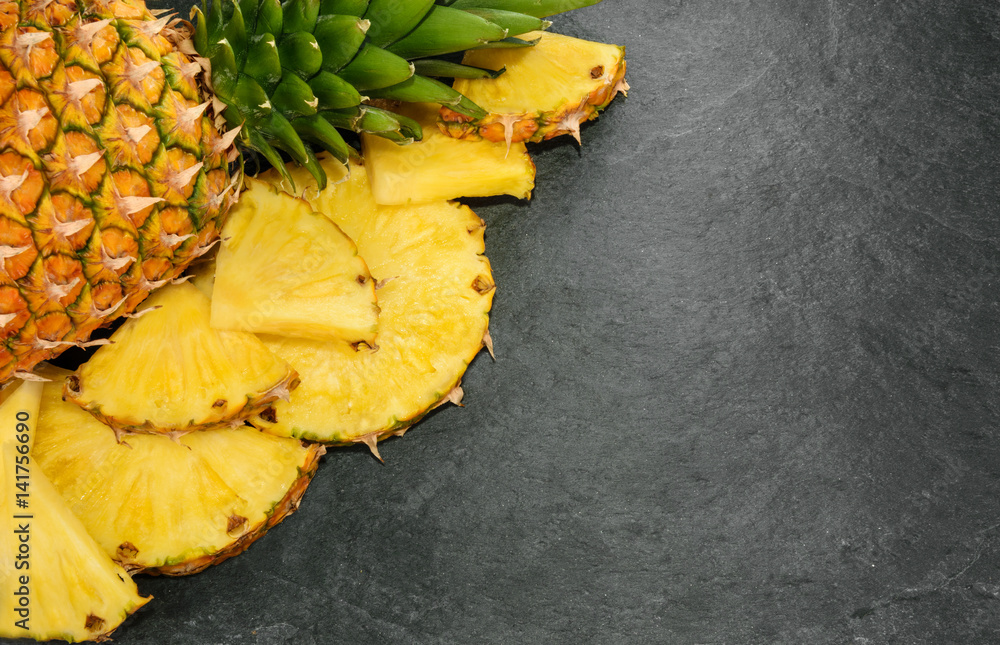 Pineapple on stone background with copy space