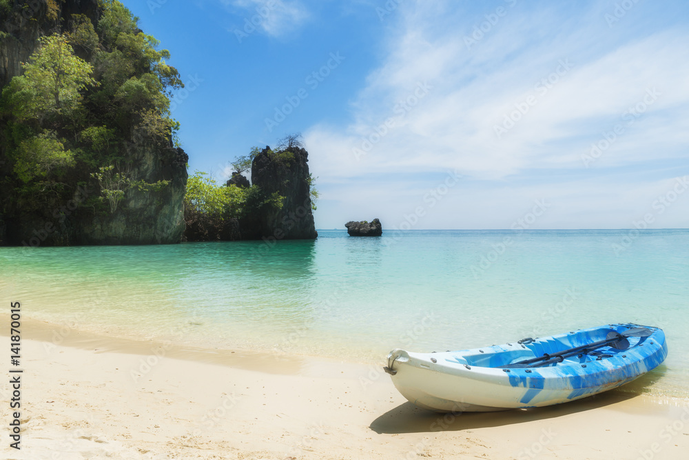 Blue kayaks on the tropical beach in Phuket, Thailand. Summer, Vacation and Travel concept.