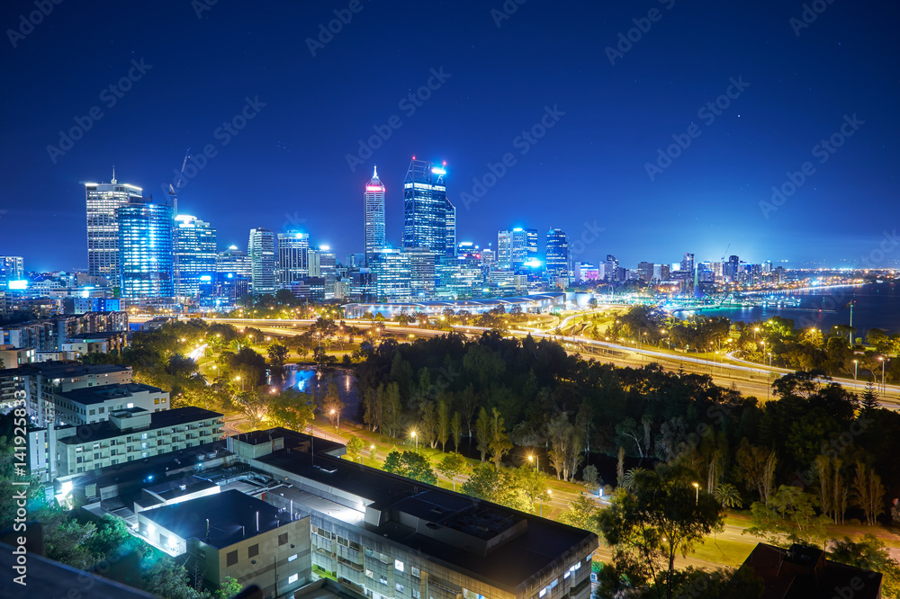 Skyline city of Perth from Kings Park with a view of John Oldany Park at night. Australia .