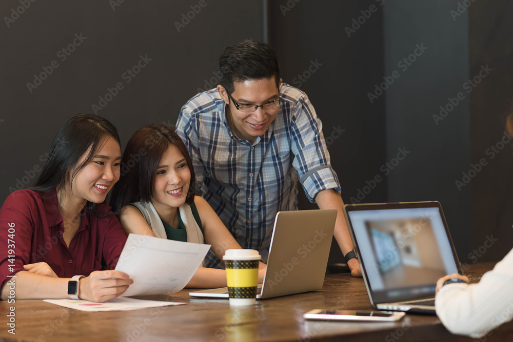 Four teenager meeting together working with laptop