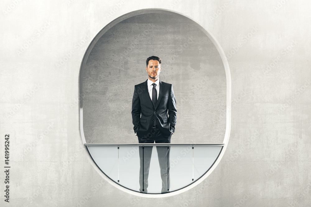 Man looking out of round window