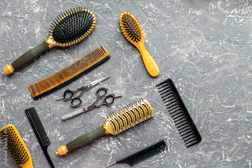 hairdressing concept with barber tools on gray background top view mock-up