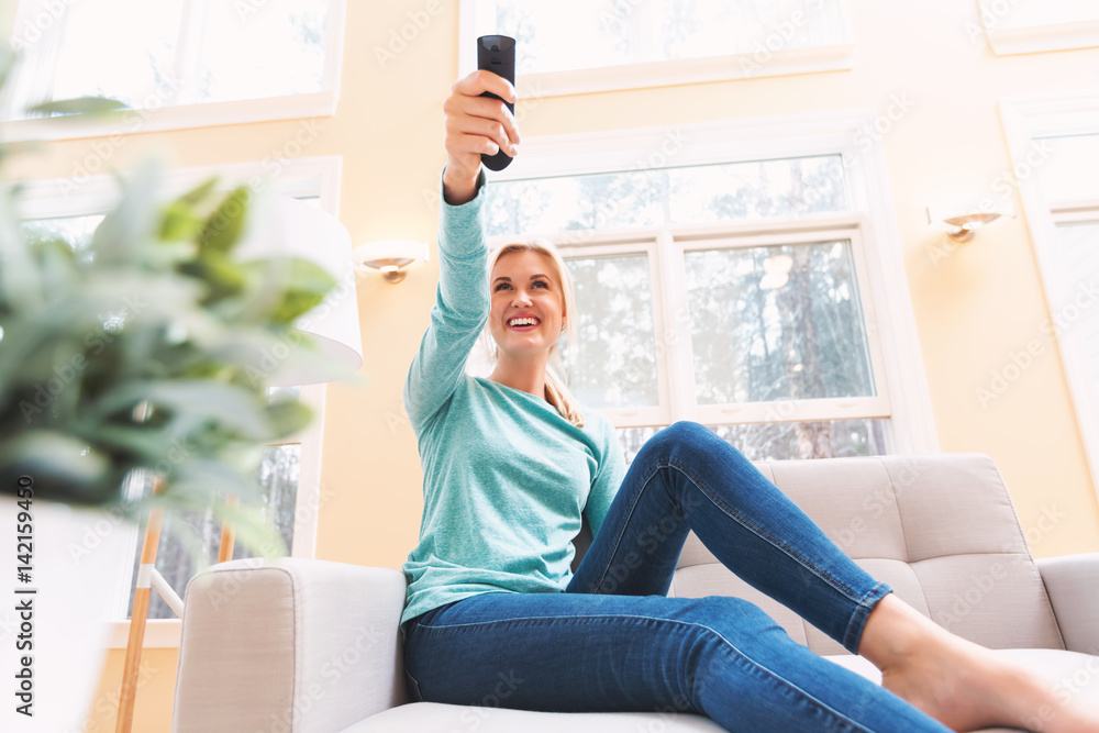 Young woman watching TV