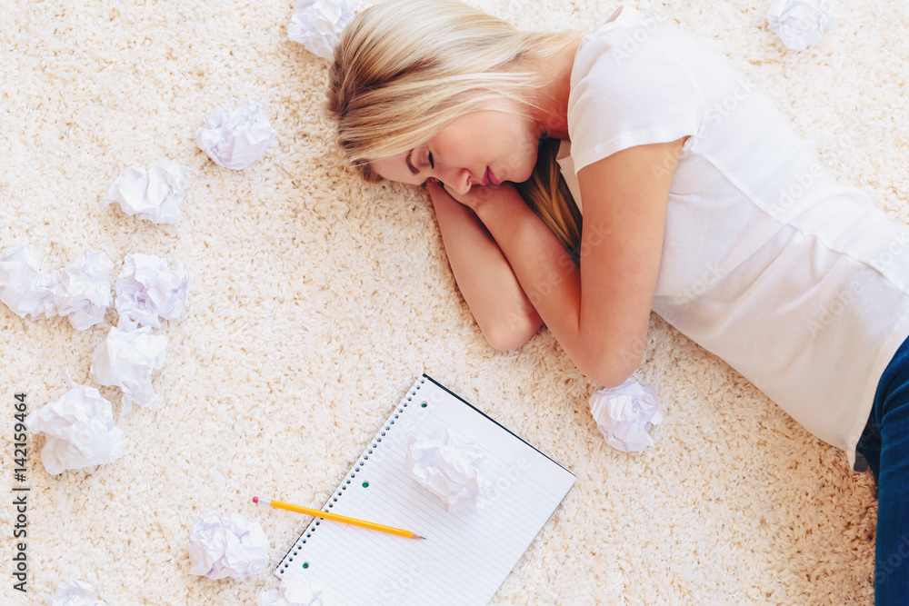 Young woman with crumpled paper