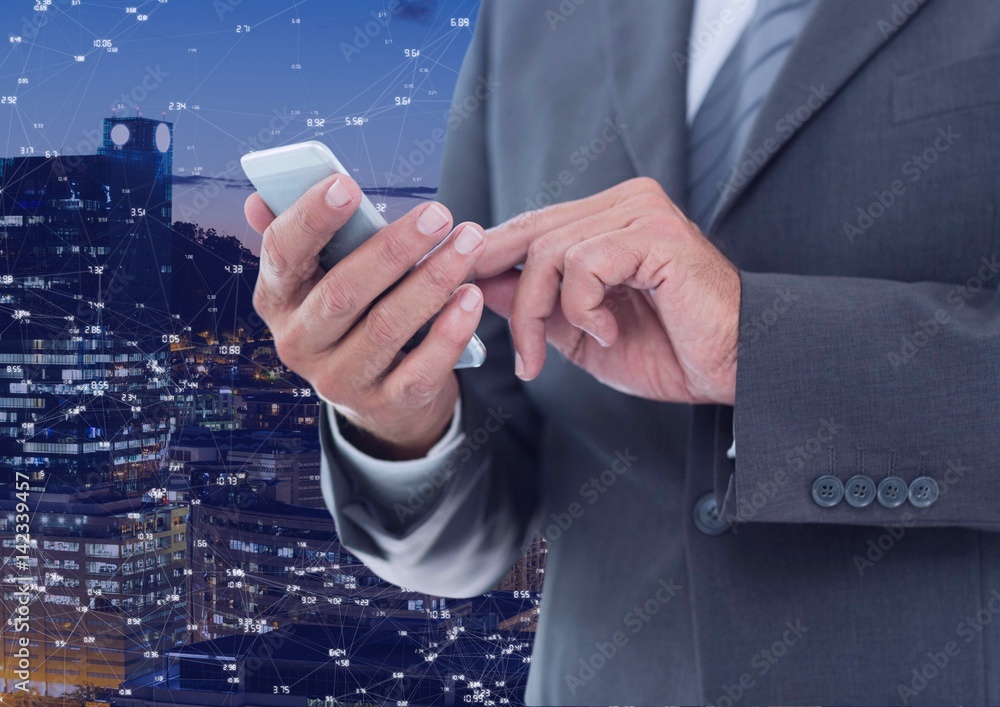 Businessman touching phone against Night city with connectors