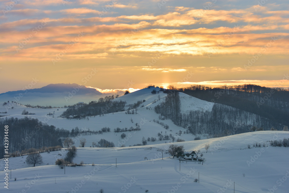 Beautiful winter mountain landscape with snowflakes in frosty winter day. Carpathian wild mountains.