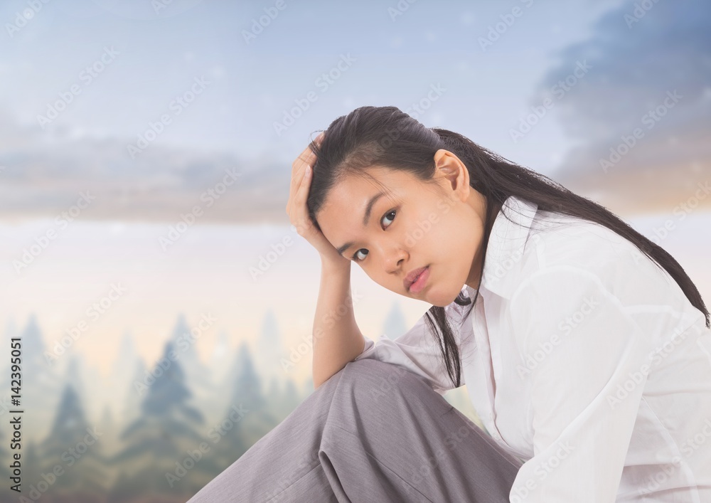 Tired disappointed young woman against magical sky