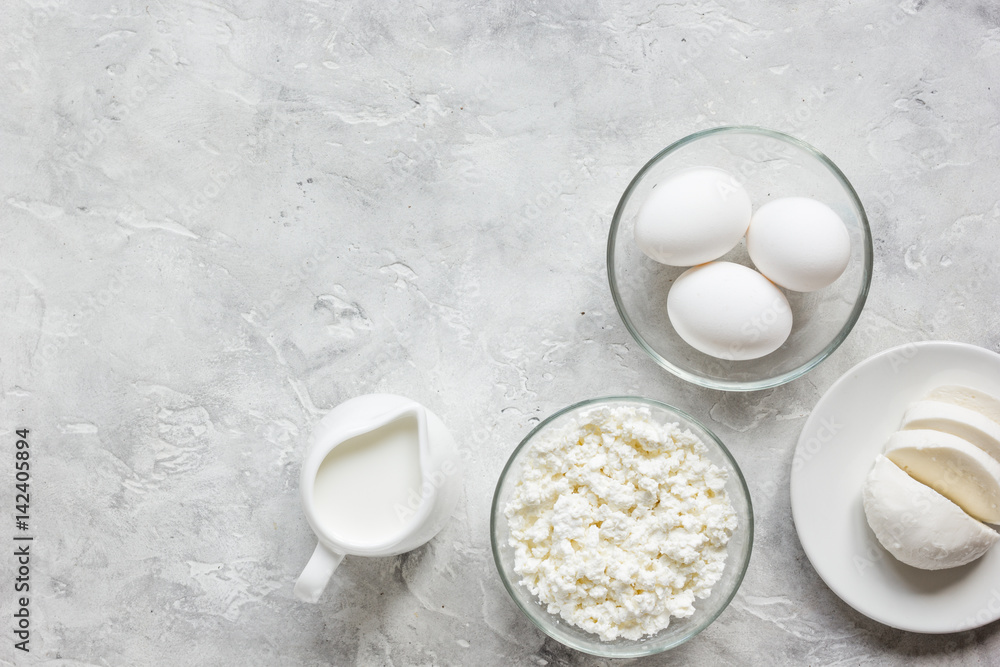 monochrome concept with dairy products on stone table top view mock up