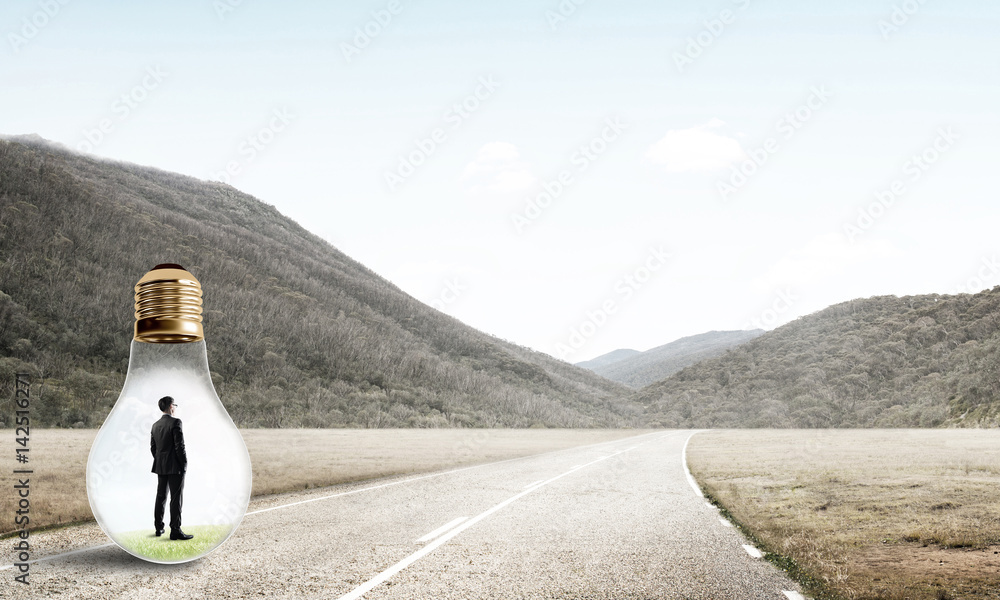 Businessman inside light bulb