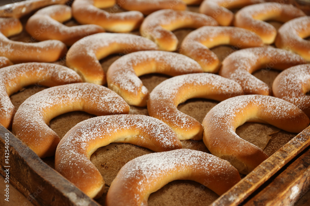 Wooden pallet with bagels, closeup