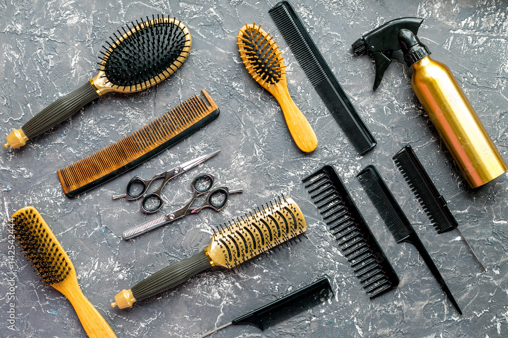 hair cutting preparation with hairdresser tools on desk background top view