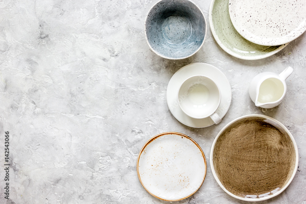 ceramic tableware top view on stone background mock up