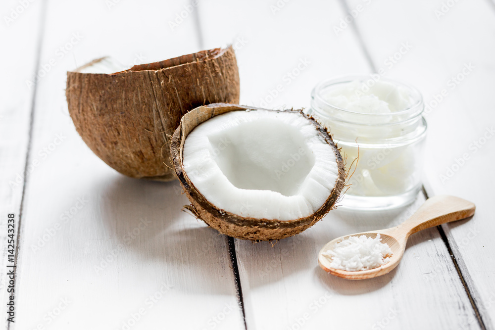 cosmetic concept with fresh coconuts on white table background