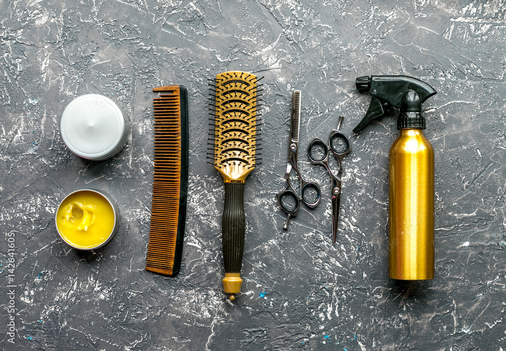 styling hair with tools in barbershop on gray background top view mock-up