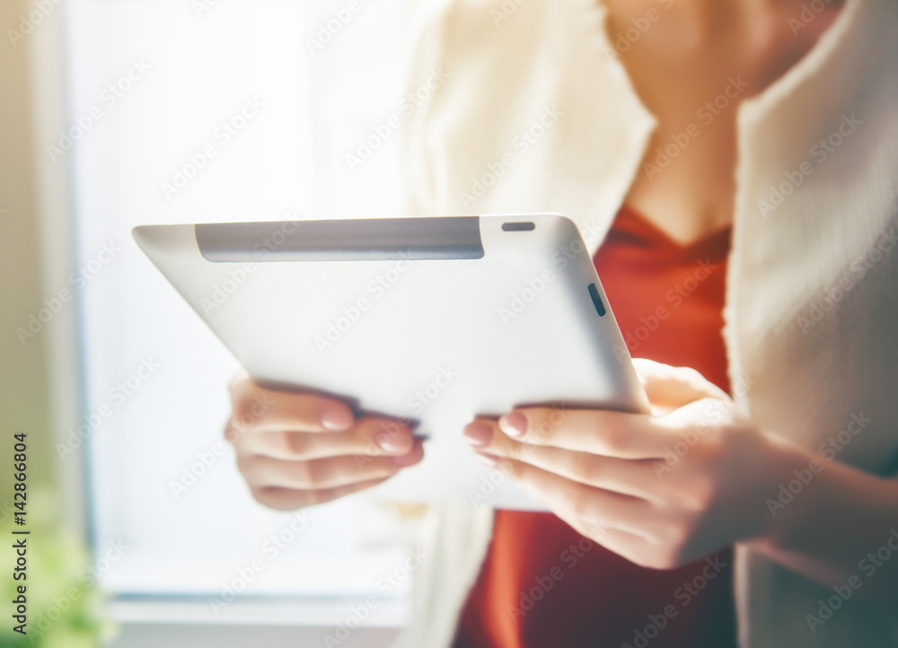 Woman working on the tablet