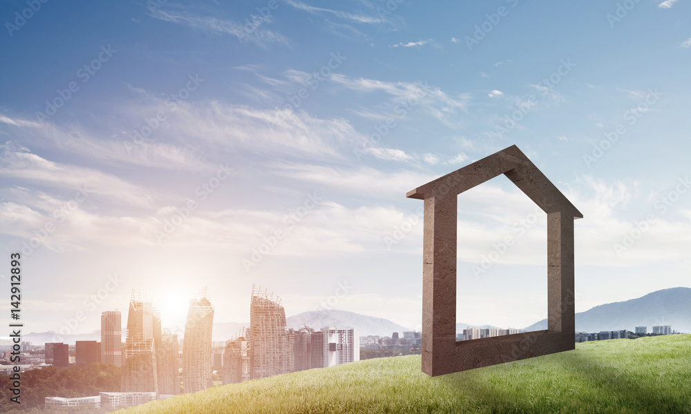 Conceptual image of concrete home sign on hill and natural landscape at background