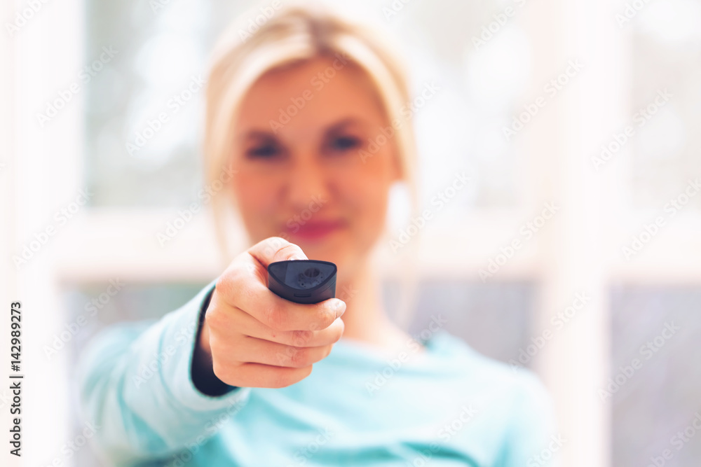 Young woman watching TV