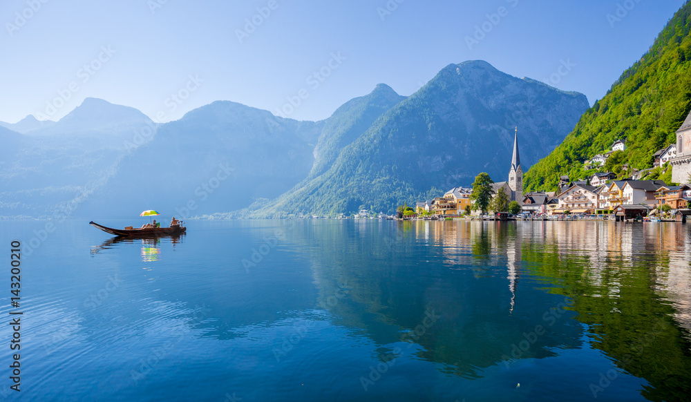 Hallstatt with traditional Plätte boat in summer, Salzkammergut, Austria