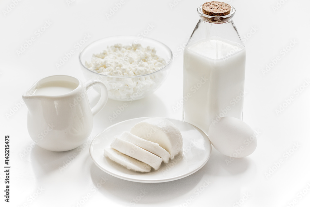 dairy products for proteic meal on white table background