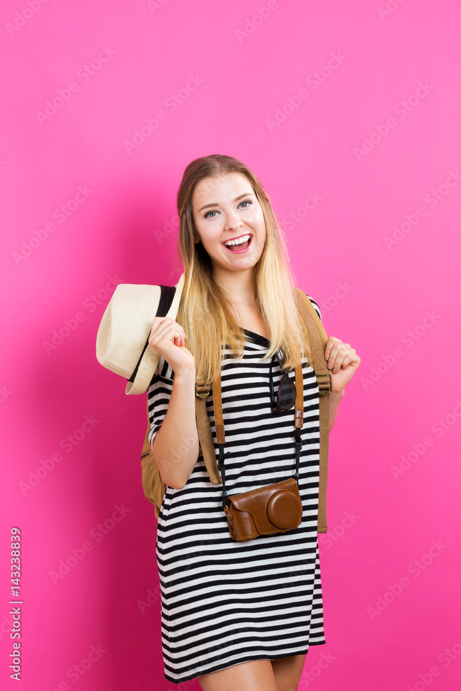 Happy young traveling woman