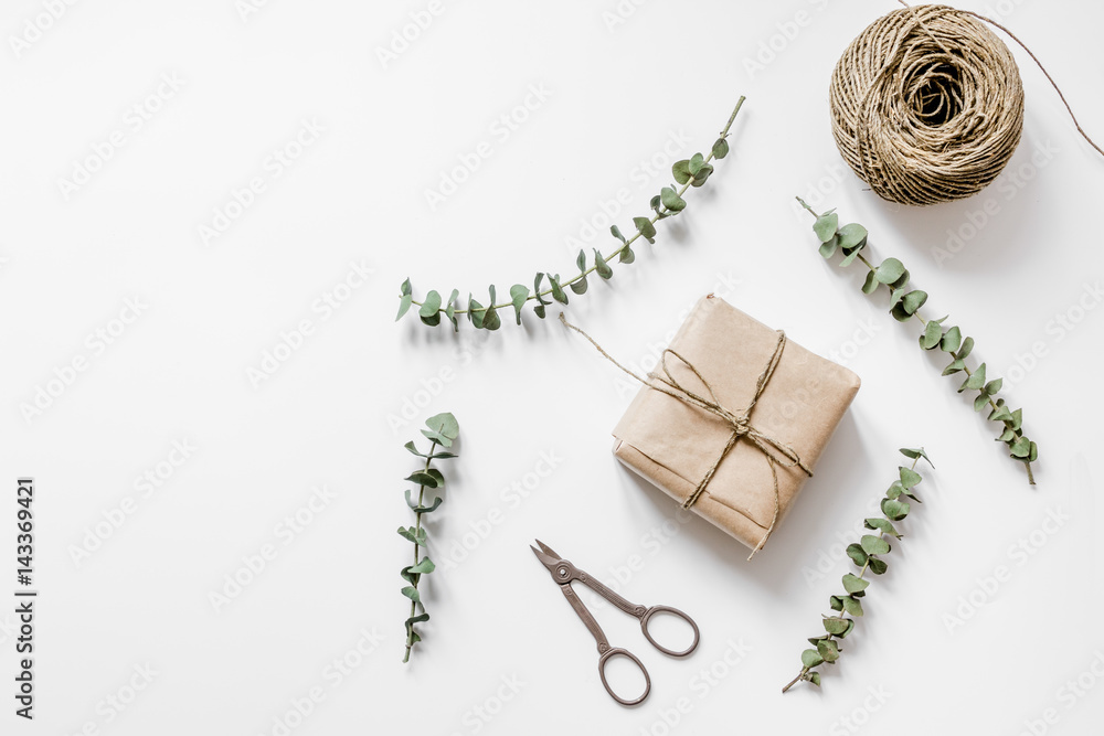 Gift box with flowers on white background top view space for text