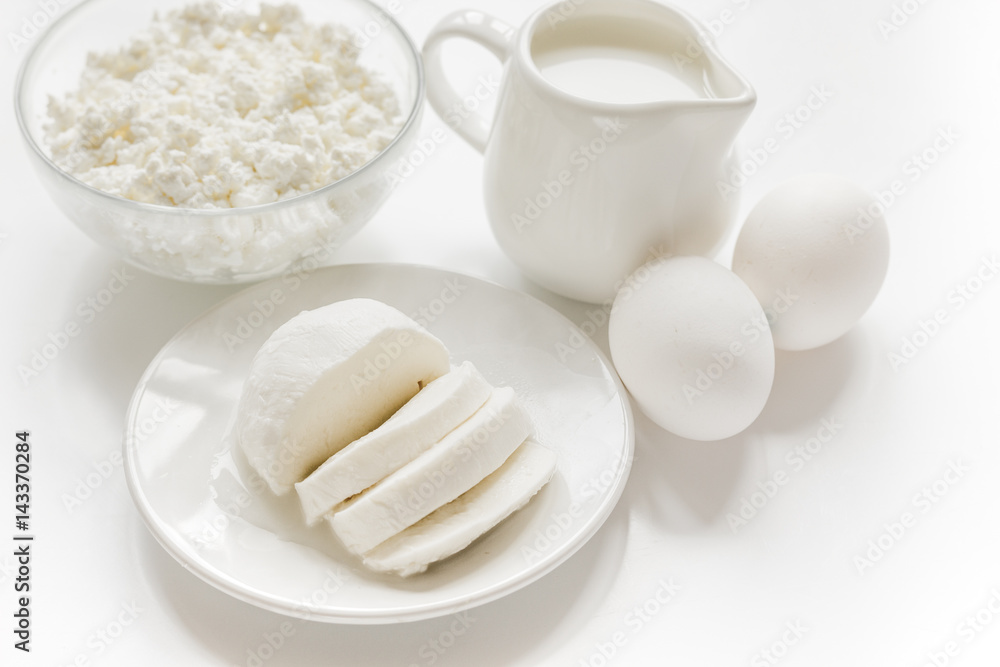 dairy products for proteic meal on white table background