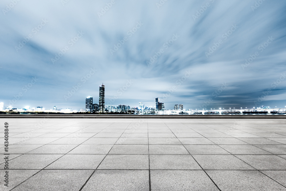 empty brick floor with cityscape and skyline