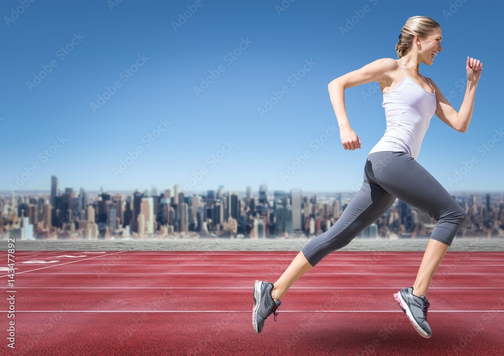 Female runner going on track against skyline