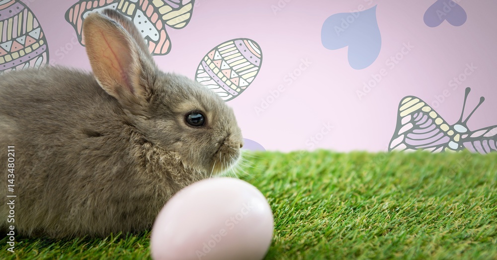 Easter rabbit with egg in front of pattern