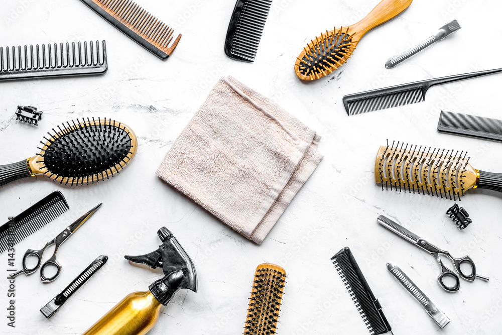 styling hair with tools in barbershop on white background top view