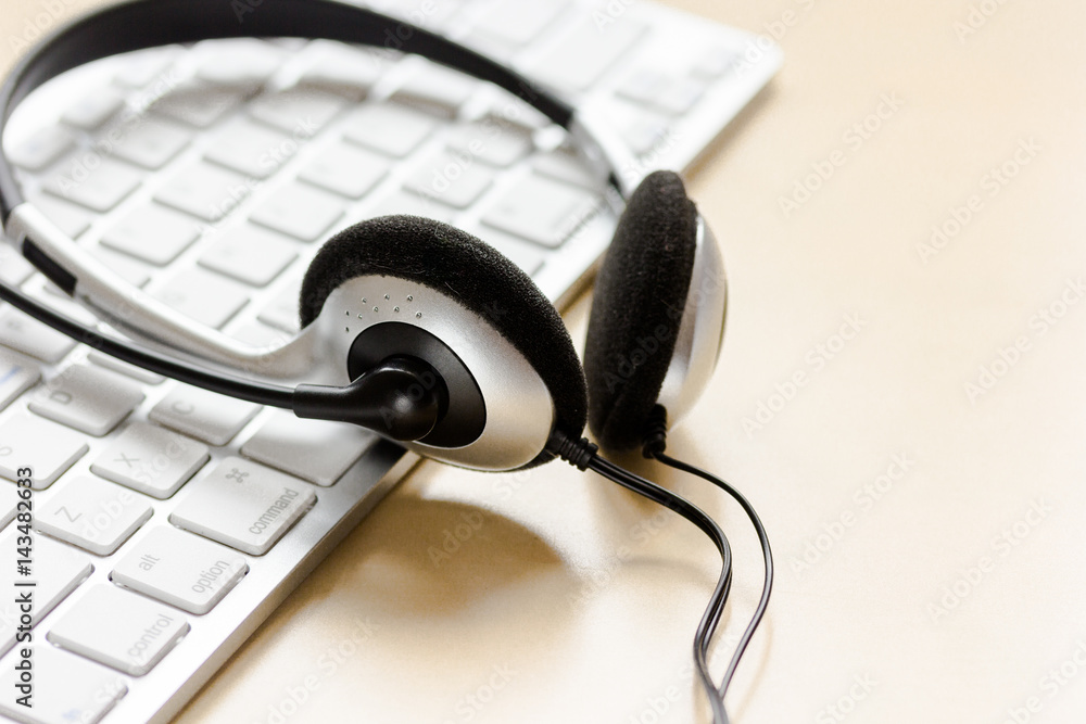 call center manager work desk with headset and keyboard