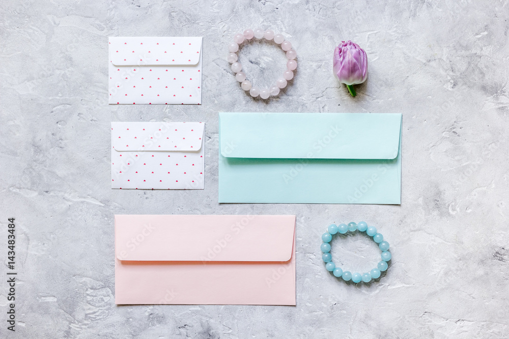 gift preparation with cards and envelopes on gray background top view