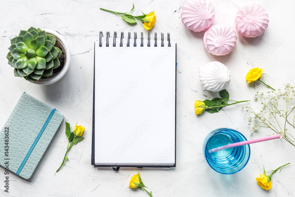 trendy office desk with roses marble background top view space for text