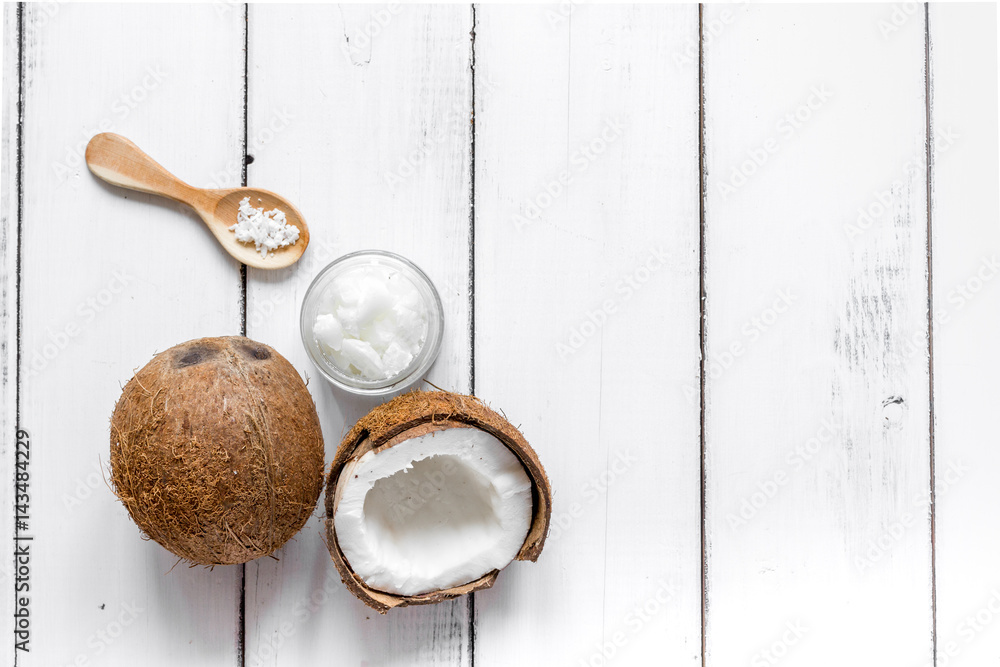 coconut oil in cosmetic concept on white desk top view