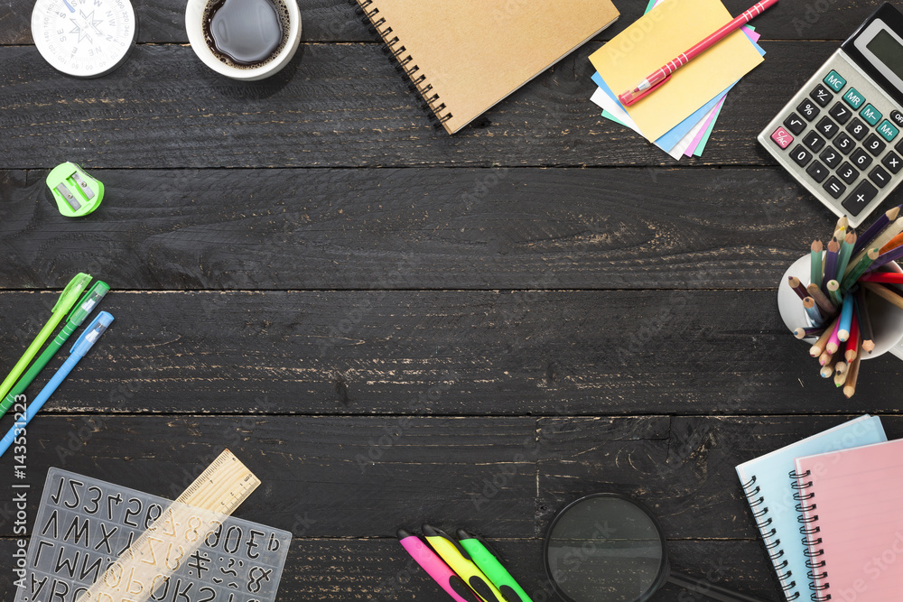 Black wooden table with Business workplace and business objects.